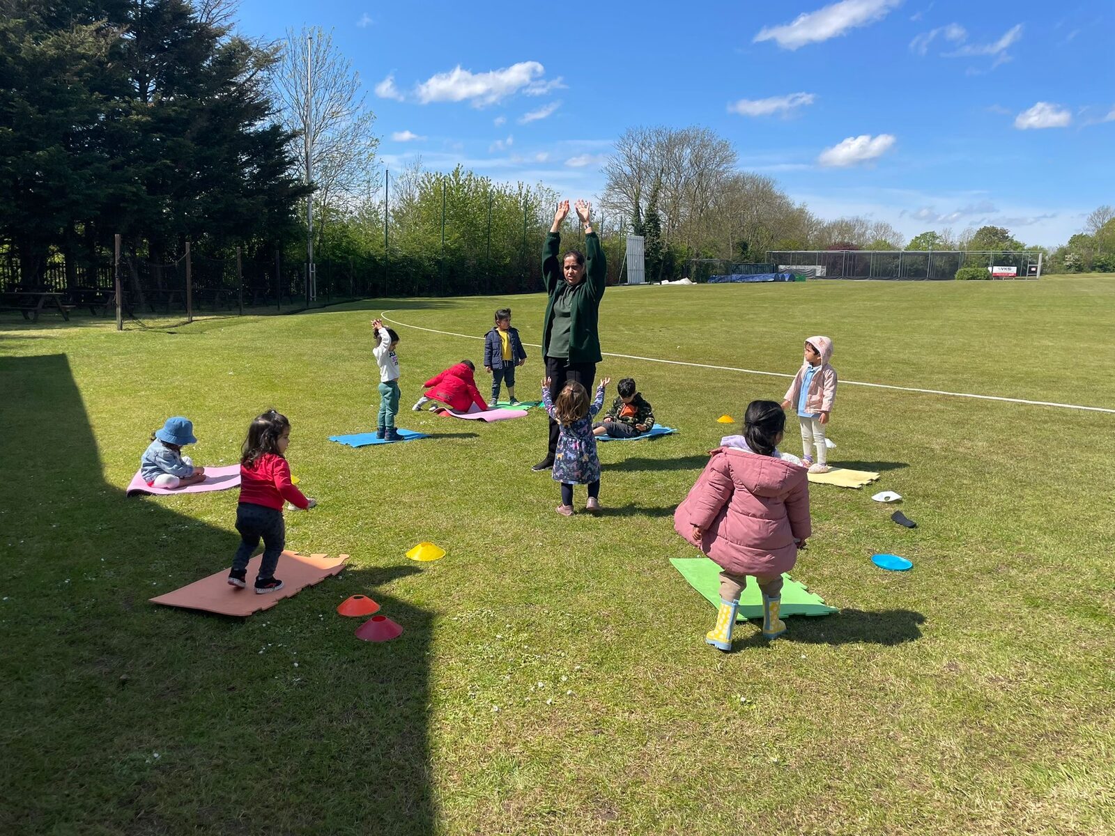 Children enjoying outdoor learning and gardening activities at Apple Tree Montessori Nursery in Harrow